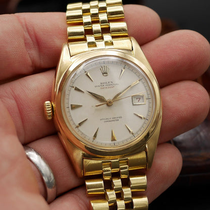 Rolex Oyster Perpetual Date Just Ref: 6104 in Yellow gold. Circa: 1961.