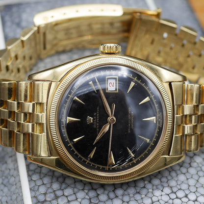 Rolex Oyster Perpetual Date Ref: 6075 in Yellow gold. Circa: 1950.