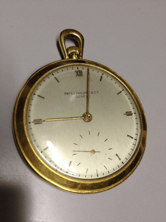 Vintage Patek Philippe pocket watch in yellow gold, circa 1940, featuring a small seconds subdial at 6 o’clock.