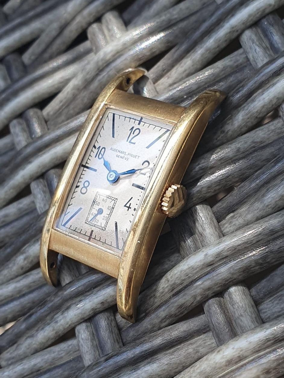 1937 Audemars Piguet Cintrée wristwatch in yellow gold with elongated curved lugs, signed dial and movement – rare vintage design.