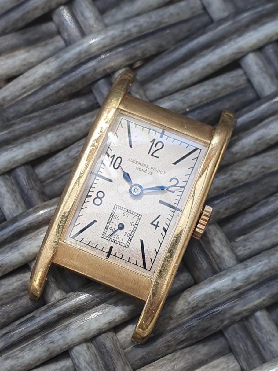 1937 Audemars Piguet Cintrée wristwatch in yellow gold with elongated curved lugs, signed dial and movement – rare vintage design.