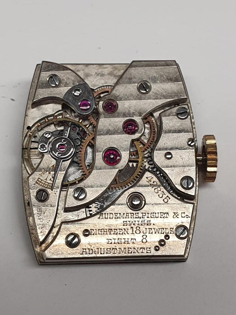 1937 Audemars Piguet Cintrée wristwatch in yellow gold with elongated curved lugs, signed dial and movement – rare vintage design.