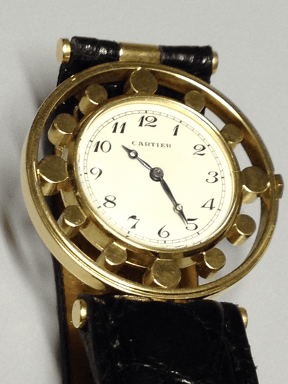 Vintage Cartier Gouvernail watch in yellow gold, circa 1960, featuring Breguet numerals, blue steel hands, and a unique cylindrical hour marker design.