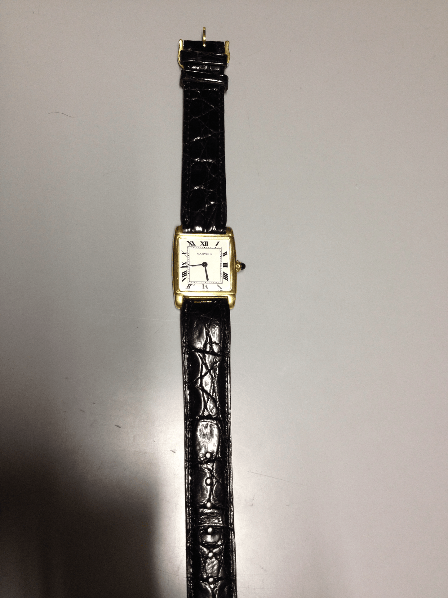 Cartier Tank with fold over case in Yellow gold. Circa: 1960.