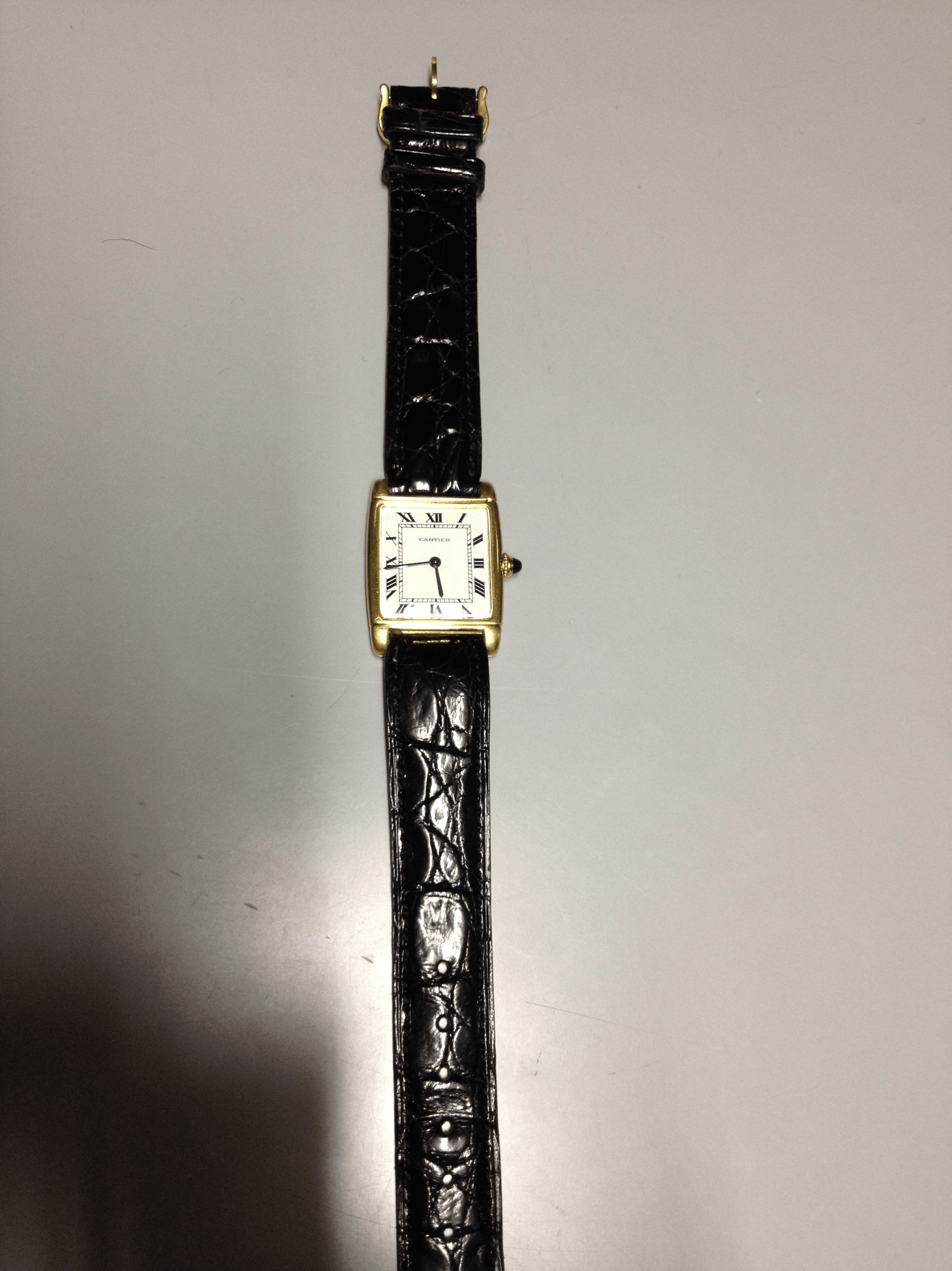 Cartier Tank with fold over case in Yellow gold. Circa: 1960.