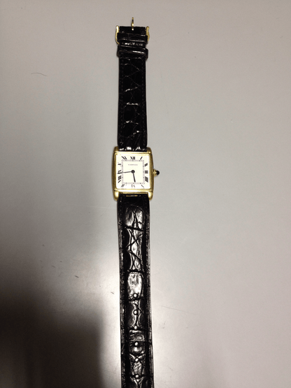 Cartier Tank with fold over case in Yellow gold. Circa: 1960.