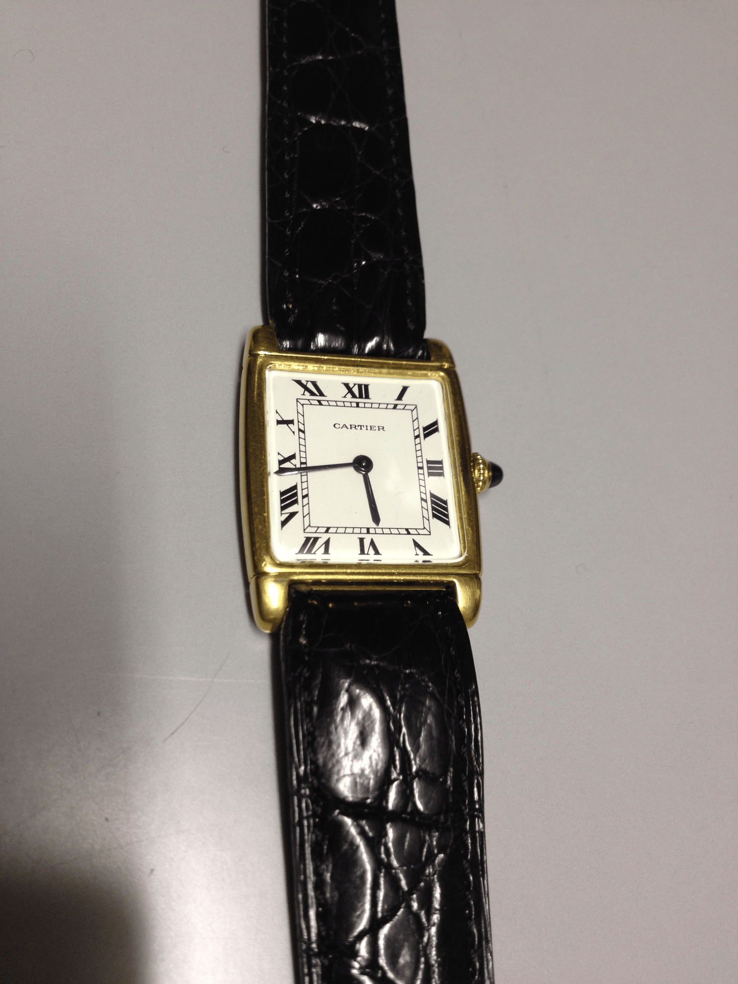 Cartier Tank with fold over case in Yellow gold. Circa: 1960.