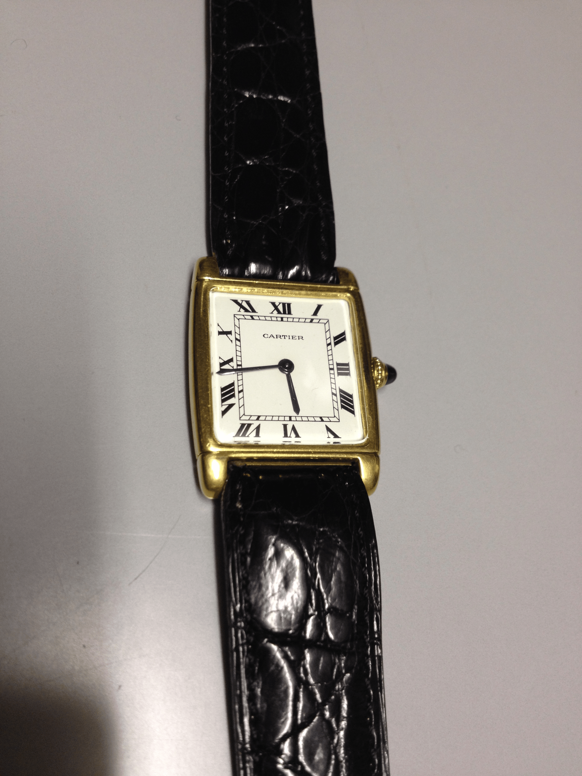 Cartier Tank with fold over case in Yellow gold. Circa: 1960.