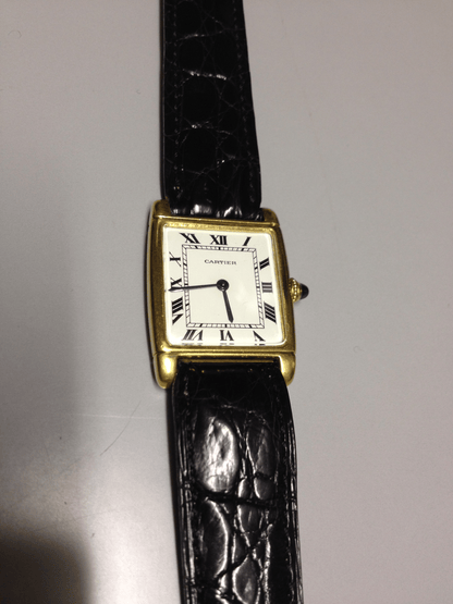 Cartier Tank with fold over case in Yellow gold. Circa: 1960.