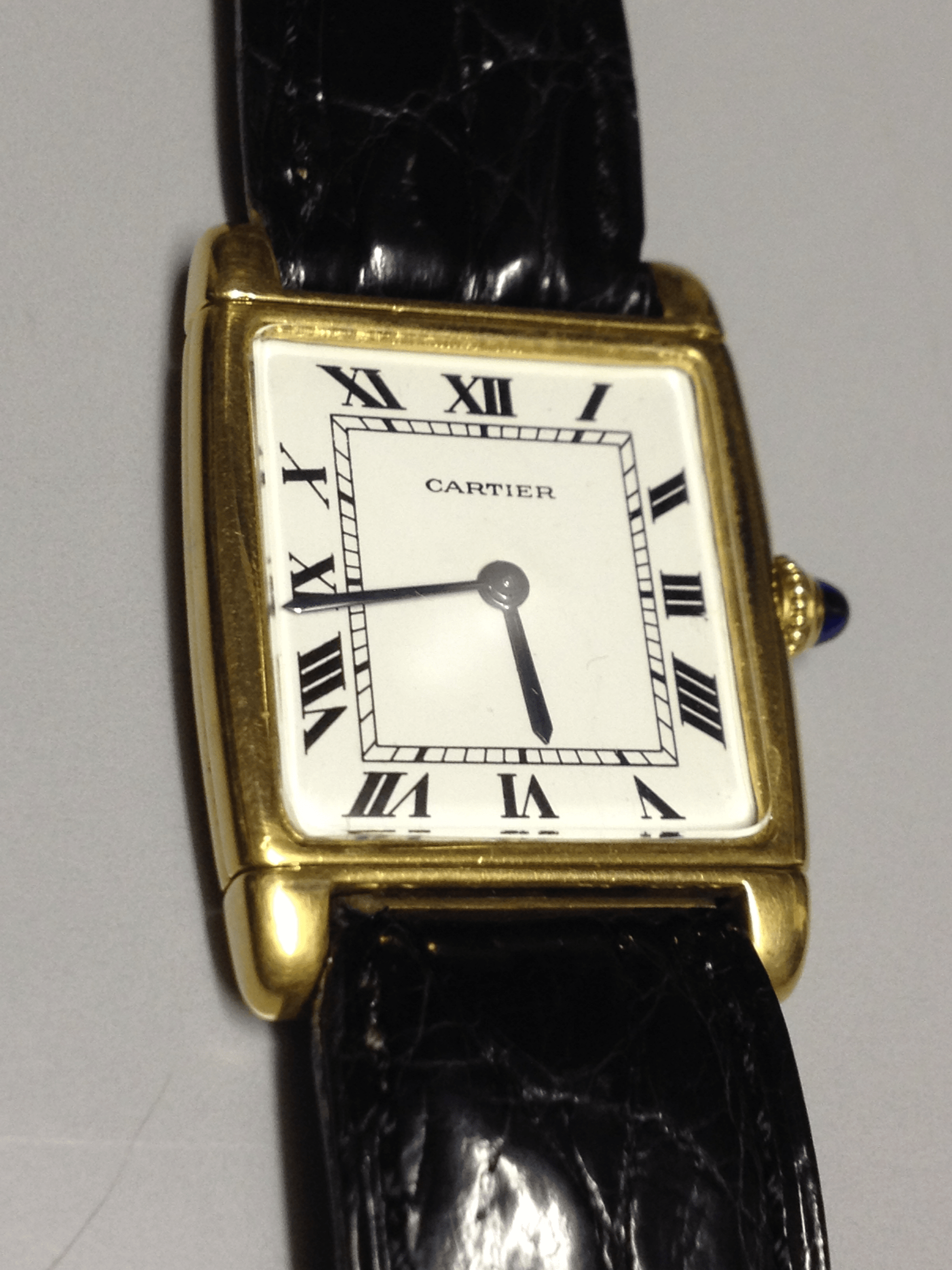 Cartier Tank with fold over case in Yellow gold. Circa: 1960.