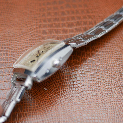 Gubelin stainless steel watch, vintage 1950, classic design, Swiss craftsmanship, timeless elegance.