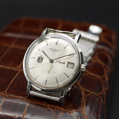 Patek Philippe Calatrava Ref 3445, white gold, circa 1960. Featuring Egypt’s coat of arms, silver dial, and the first automatic date movement.