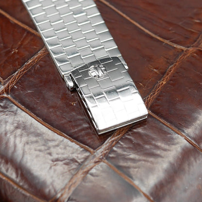 Patek Philippe Hour Glass Ref 1593 in Platinum, 1956. Oversized rectangular case, silver dial, diamond indexes. Iconic mid-century design, highly collectible.